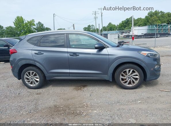 KM8J3CA46GU064816 2016 HYUNDAI TUCSON Gray Vista interior trasera
