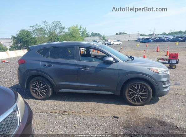 KM8J3CAL1KU061791 2019 HYUNDAI TUCSON Gray უკანა სალონის ხედი