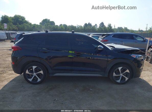 KM8J3CAL4JU694235 2018 HYUNDAI TUCSON Black Rear interior view