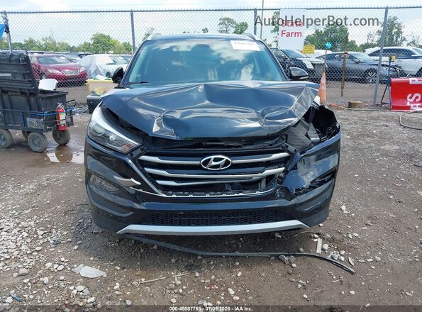 KM8J3CAL4JU746706 2018 HYUNDAI TUCSON Black Rear interior view