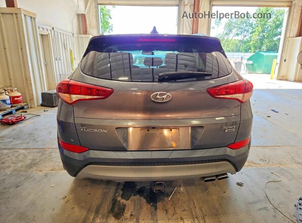 KM8J3CALXJU762862 2018 HYUNDAI TUCSON Gray უკანა ხედი