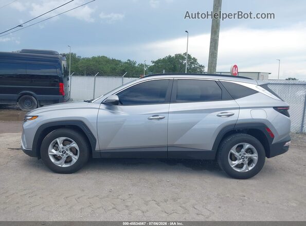 KM8JB3AE1NU080043 2022 HYUNDAI TUCSON Silver Rear interior view