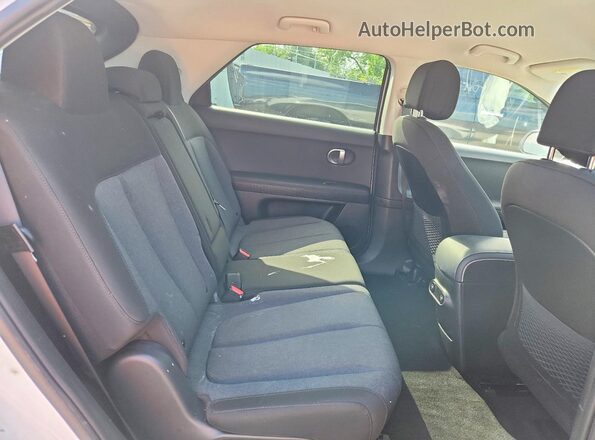 KM8KM4AE8NU080352 2022 HYUNDAI IONIQ White Vista interior trasera