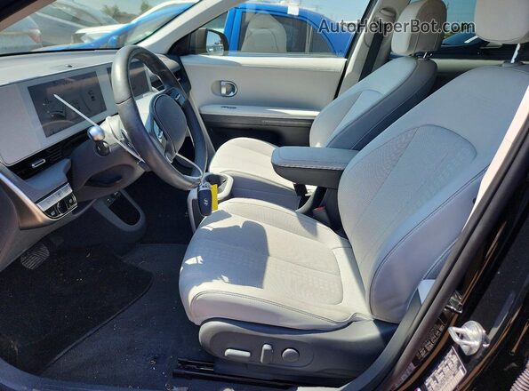 KM8KNDAF9PU207859 2023 HYUNDAI IONIQ Черный Вид салона спереди