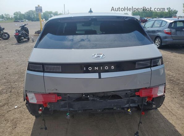 KM8KNDDF1RU329520 2024 HYUNDAI IONIQ Silver უკანა ხედი