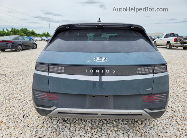 KM8KNDDFXRU273478 2024 HYUNDAI IONIQ Gray Widok z tyłu