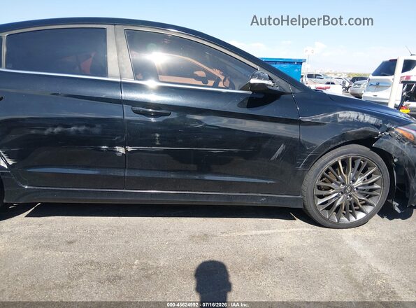 KMHD04LBXHU345333 2017 HYUNDAI ELANTRA Black Widok wnętrza z tyłu