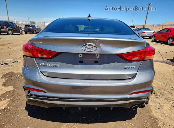 KMHD04LBXJU614601 2018 HYUNDAI ELANTRA Silver უკანა ხედი