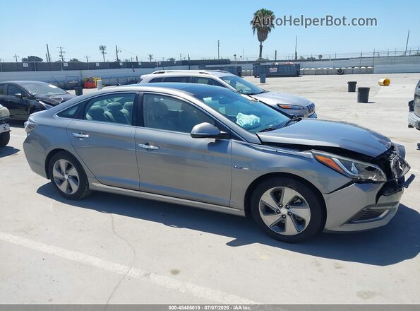 KMHE34L11HA056569 2017 HYUNDAI SONATA HYBRID Silver Vista interior trasera