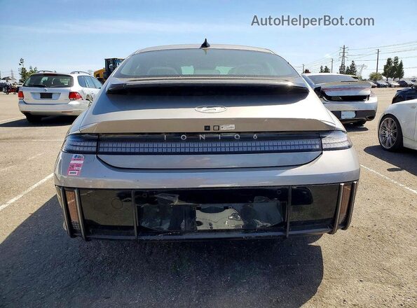 KMHM54AA6RA075659 2024 HYUNDAI IONIQ Серебряный Вид сзади