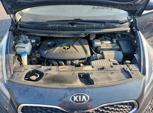 KNAHT8A34G7160771 2016 KIA RONDO Blue Widok wnętrza z tyłu
