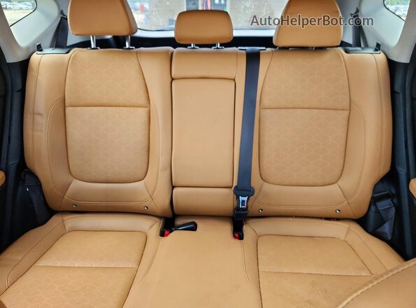 KNDER2AA7R7525737 2024 KIA SELTOS Black Vista de los asientos traseros