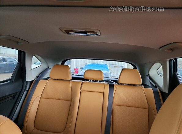 KNDERCAA2R7542466 2024 KIA SELTOS Black Vista de los asientos traseros