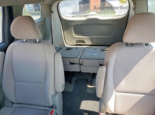 KNDMA5C12H6270730 2017 KIA SEDONA Burgundy Rear seats view