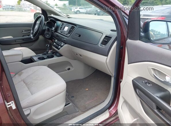 KNDMB5C15G6085776 2016 KIA SEDONA Purple Вид салону спереду