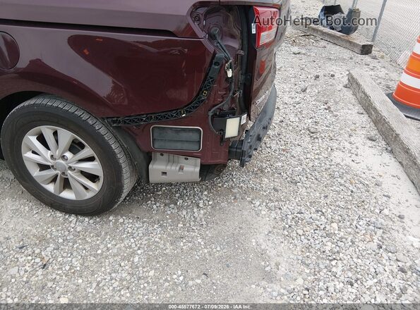 KNDMB5C19J6379978 2018 KIA SEDONA Maroon Front interior view