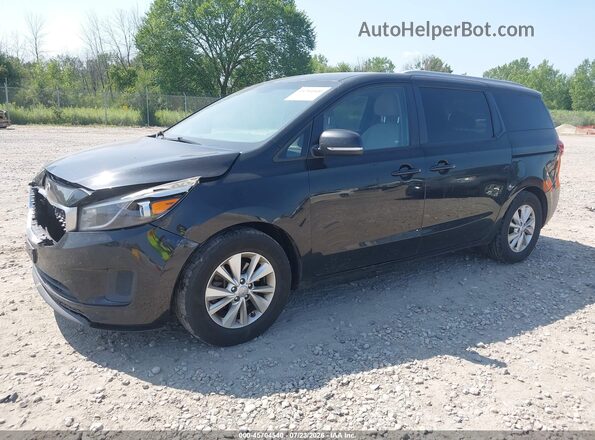 KNDMB5C1XG6163534 2016 KIA SEDONA Black Vista tres cuartos delantera izquierda