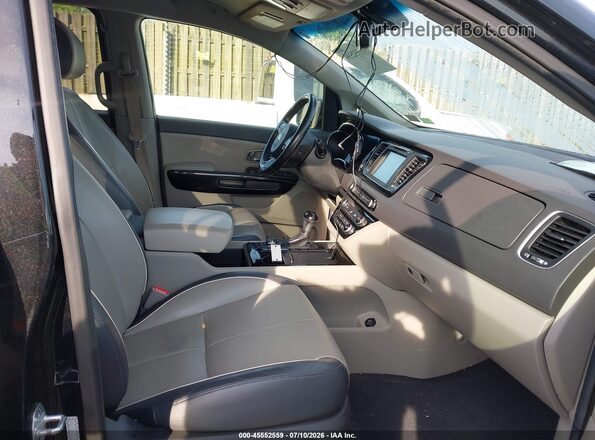 KNDMC5C17G6131377 2016 KIA SEDONA Black Front interior view