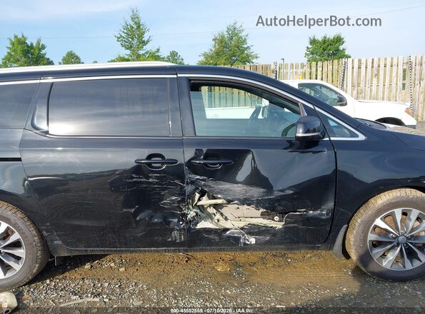 KNDMC5C17G6131377 2016 KIA SEDONA Black Rear interior view