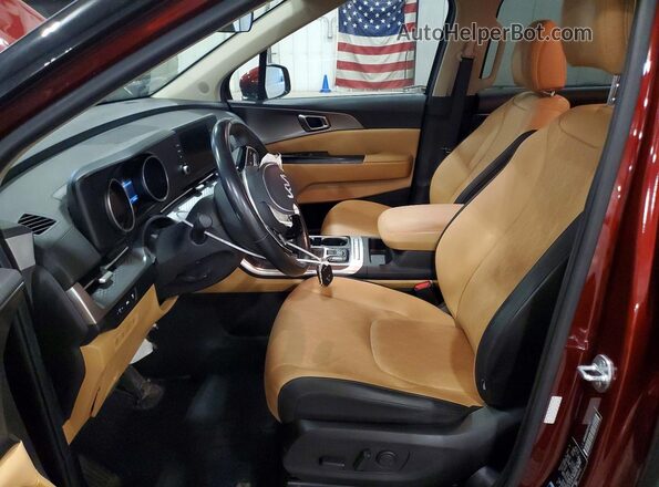 KNDNB4H31P6205212 2023 KIA CARNIVAL Maroon წინა სალონის ხედი