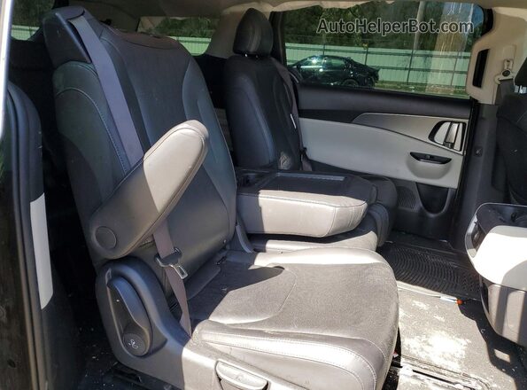 KNDNB4H33P6290957 2023 KIA CARNIVAL Black Widok wnętrza z tyłu