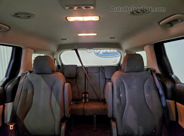 KNDNB4H38P6244976 2023 KIA CARNIVAL Gray Vista de los asientos traseros