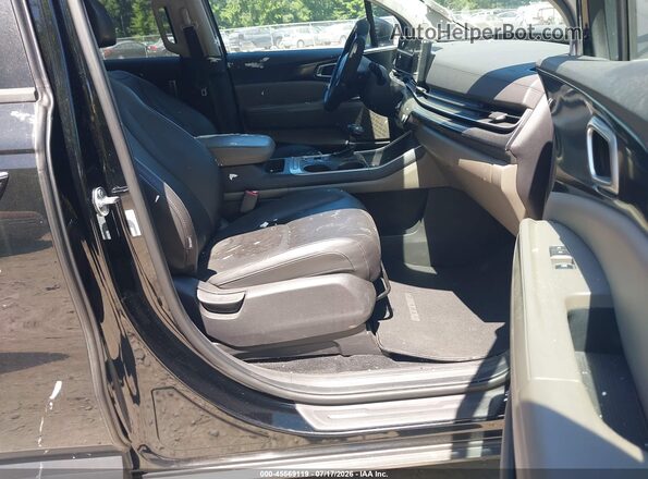 KNDNB5K32S6476786 2025 KIA CARNIVAL MPV Black Widok wnętrza z przodu