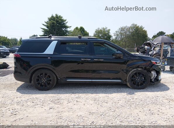 KNDNE5H38N6060938 2022 KIA CARNIVAL MPV Black Widok wnętrza z tyłu
