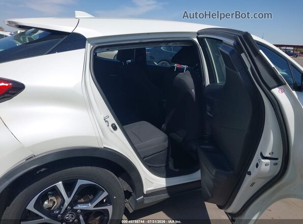 NMTKHMBX9JR009764 2018 TOYOTA C-HR Белый Вид наклейки с VIN-кодом