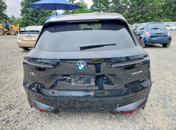 WB523CF01RCR78958 2024 BMW IX Black Rear view