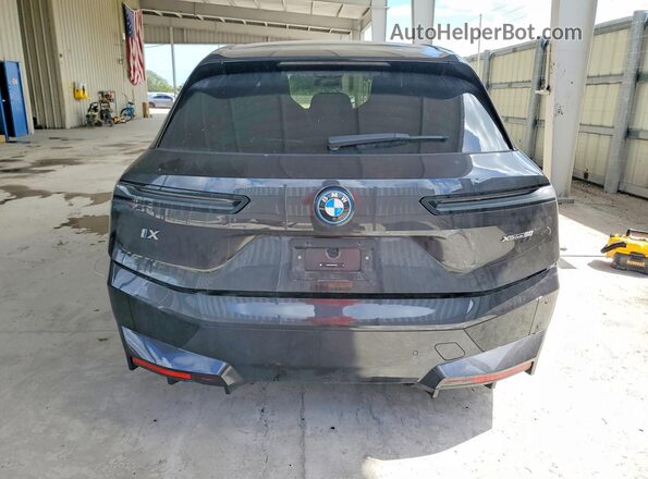 WB523CF03RCP19890 2024 BMW IX Gray Widok z tyłu