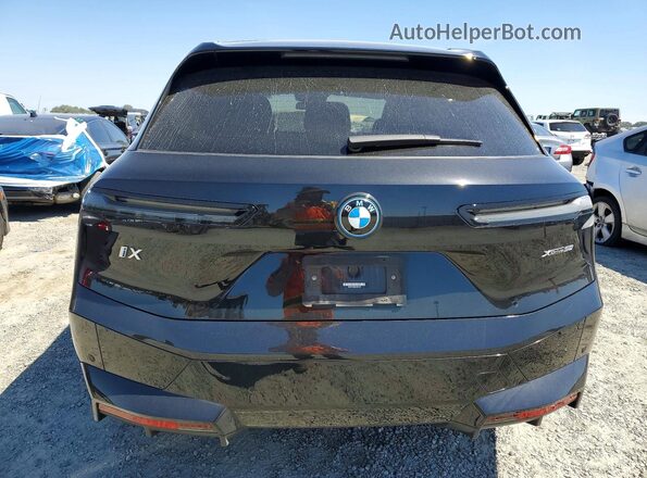 WB523CF06RCN55907 2024 BMW IX Black Widok z tyłu