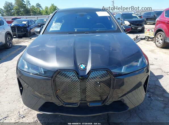 WB543CF0XTCV06385 2026 BMW IX Black Вид задньої частини салону