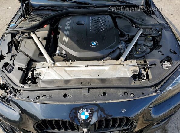 WBA13AR0XMCF61542 2021 BMW M4 Black Vista interior trasera