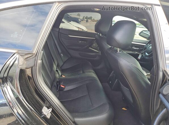 WBA4B1C54GG242720 2016 BMW OTHER Black Widok tylnych siedzeń