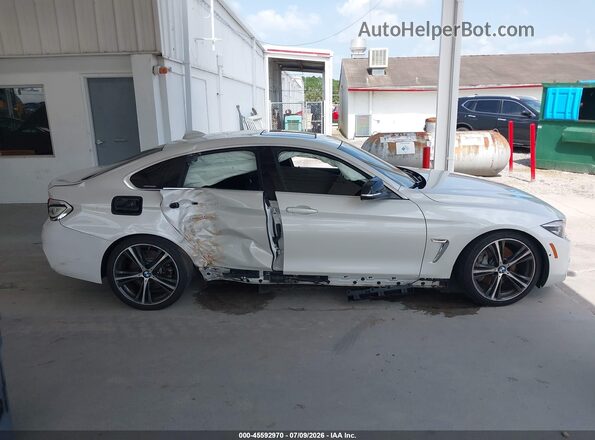 WBA4J7C56JBH13778 2018 BMW 4 SERIES White Widok wnętrza z tyłu