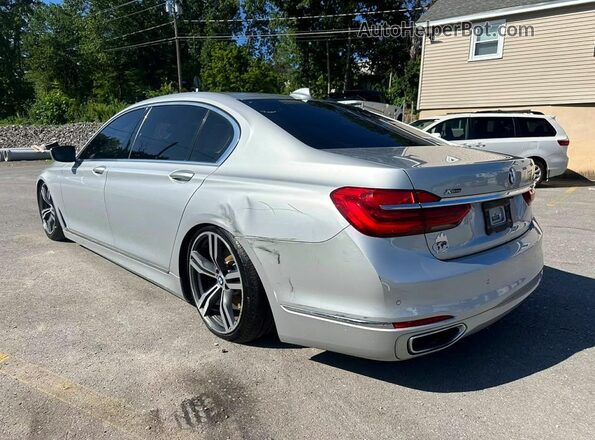 WBA7F2C52GG418042 2016 BMW 7 SERIES Серебряный Задняя левая четверть