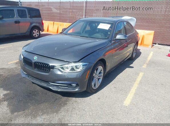 WBA8B9C52JEE82256 2018 BMW 3 SERIES Gray Vista tres cuartos delantera izquierda