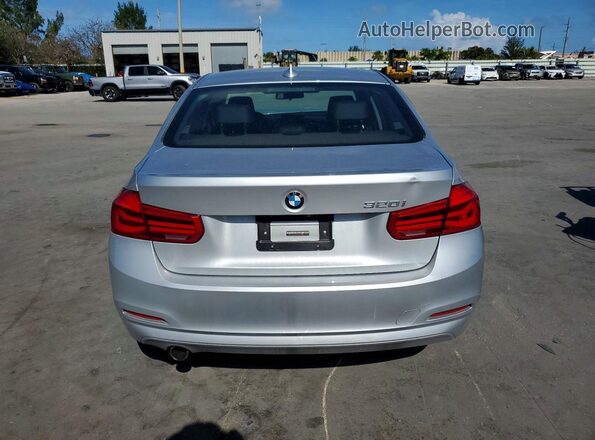 WBA8E1G59JNU92475 2018 BMW 3 SERIES Silver Rear view