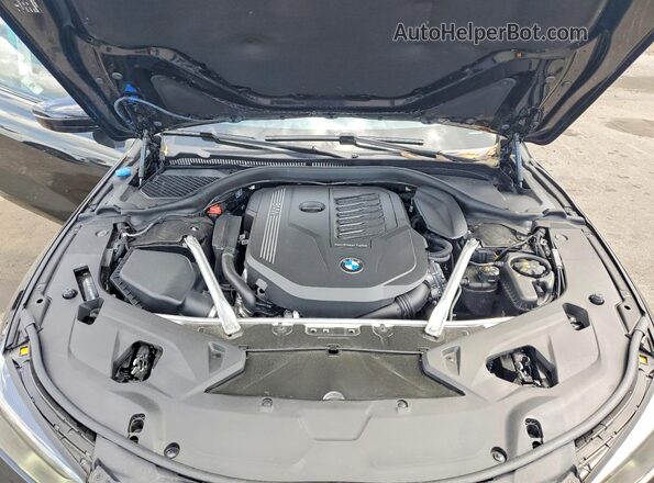 WBAAE4C02RCN50611 2024 BMW 8 SERIES Black Սալոնի հետևի տեսք