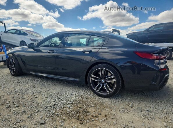 WBAGV4C05PCM39929 2023 BMW 8 SERIES Black Trasero izquierdo