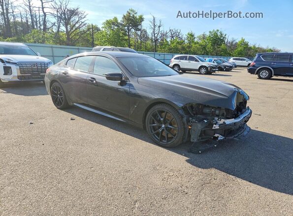 WBAGV8C00NCH86012 2022 BMW M8 Black Front right