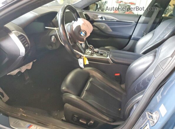 WBAGV8C02MCG42752 2021 BMW M8 Blue Front interior view