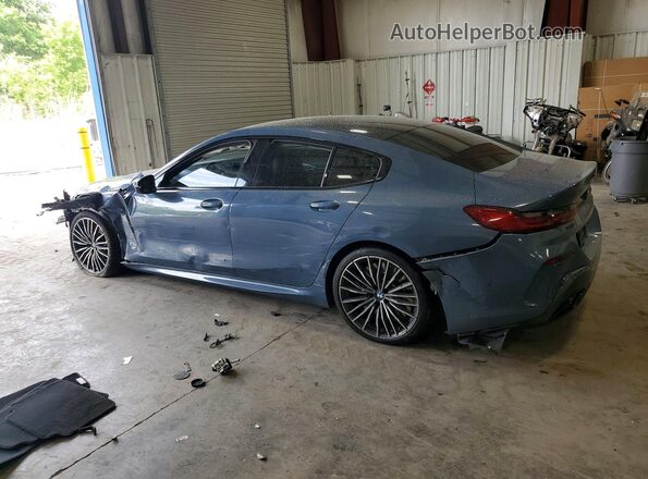 WBAGV8C02MCG42752 2021 BMW M8 Blue Rear left