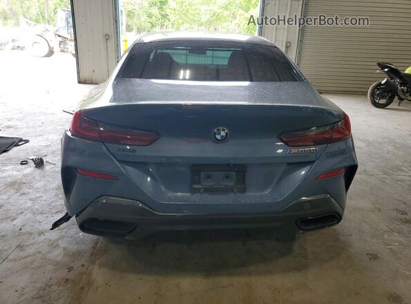 WBAGV8C02MCG42752 2021 BMW M8 Blue Rear view