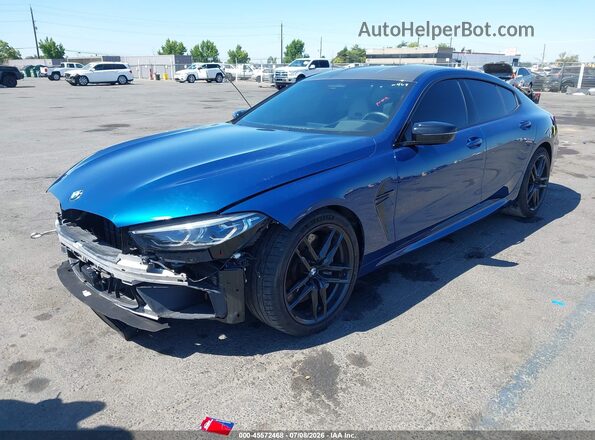 WBSGV0C05MCF84231 2021 BMW M8 Blue Առջևի ձախ երեք քառորդ տեսարան