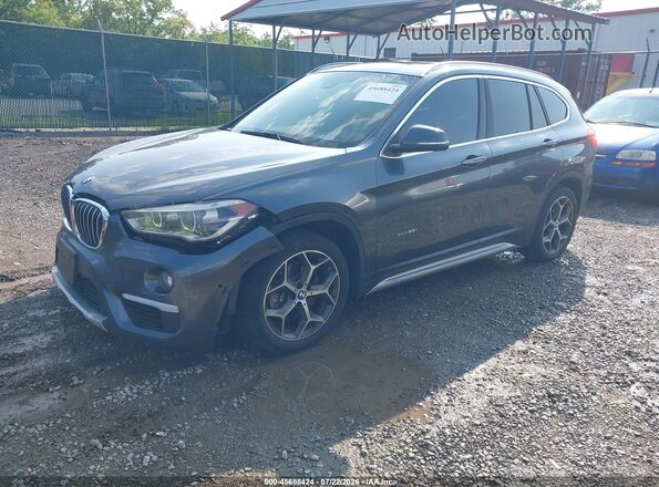 WBXHT3C30H5F73065 2017 BMW X1 Gray Front left