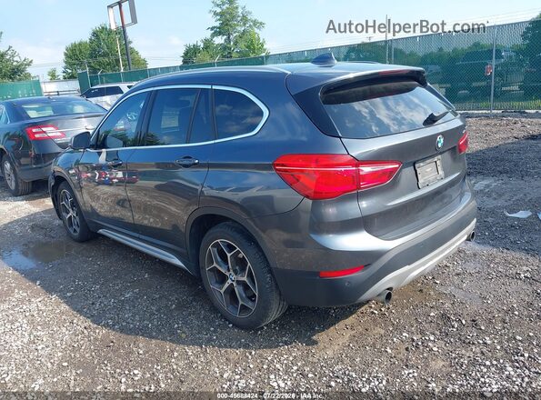 WBXHT3C30H5F73065 2017 BMW X1 Gray Rear left