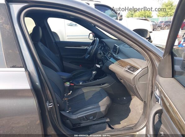 WBXHT3C30H5F73065 2017 BMW X1 Gray Front interior view