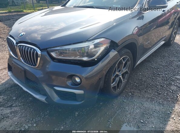 WBXHT3C30H5F73065 2017 BMW X1 Gray Front view